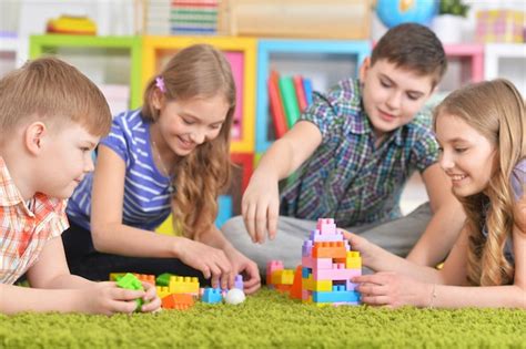 Premium Photo | Portrait of group of children playing together