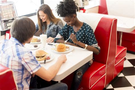 Friends eating in diner Stock Photo by ©boggy22 127991632