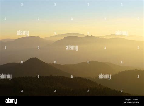 Mountain Silhouettes At The Sunset With Haze Stock Photo Alamy