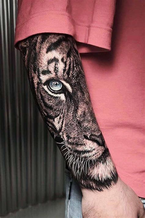 A Man S Arm With A Tiger Tattoo On It