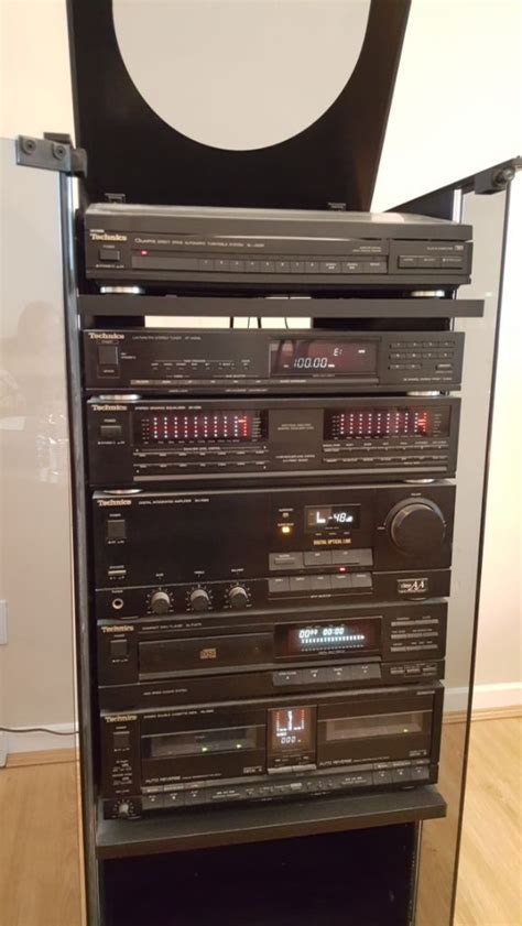 Technics Hifi System Enclosed In Wooden Cabinet With Glass Door In