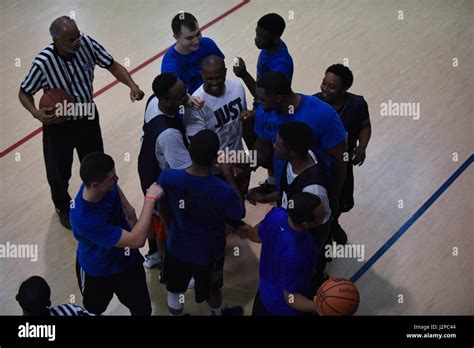 The 2nd Security Forces Squadron Basketball Team Huddles Up Before The