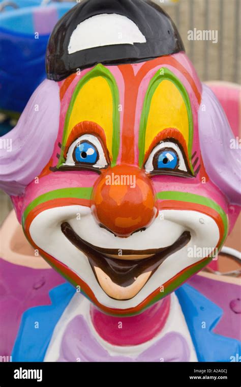 Colorfull clown face on carnival ride Stock Photo - Alamy