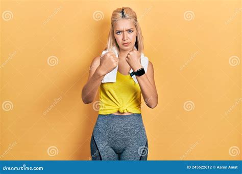 Beautiful Blonde Sports Woman Wearing Workout Outfit Ready To Fight