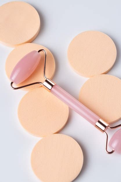 Premium Photo Pink Gua Sha Massage Tool On A White Background Closeup Rose Quartz Jade Roller