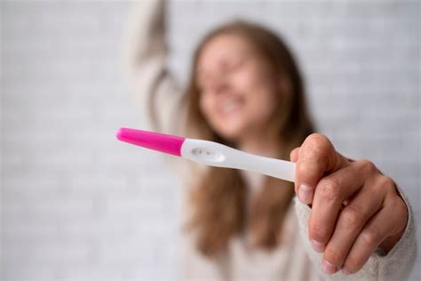 Free Photo Front View Woman Holding Positive Pregnancy Test