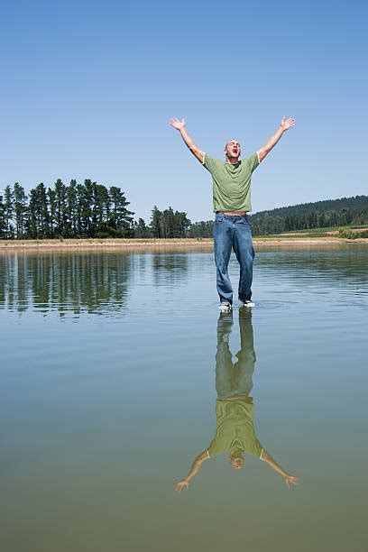 Man Walking On Water Photos Stock Photos Pictures And Royalty Free