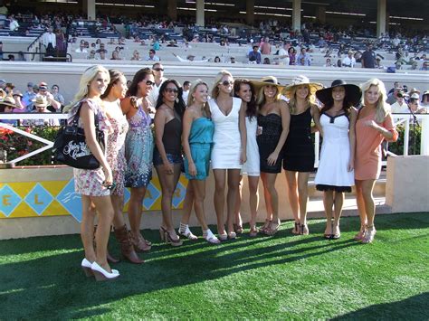 A Group Of Lovely Ladies Stand In The Winners Circle Race Day Fashion