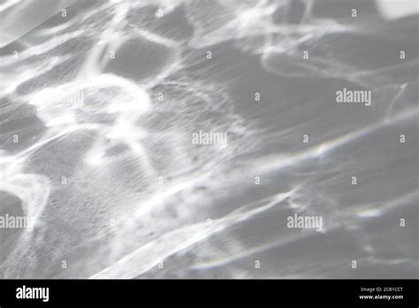 shadow  light caustic effect   white wall stock photo alamy