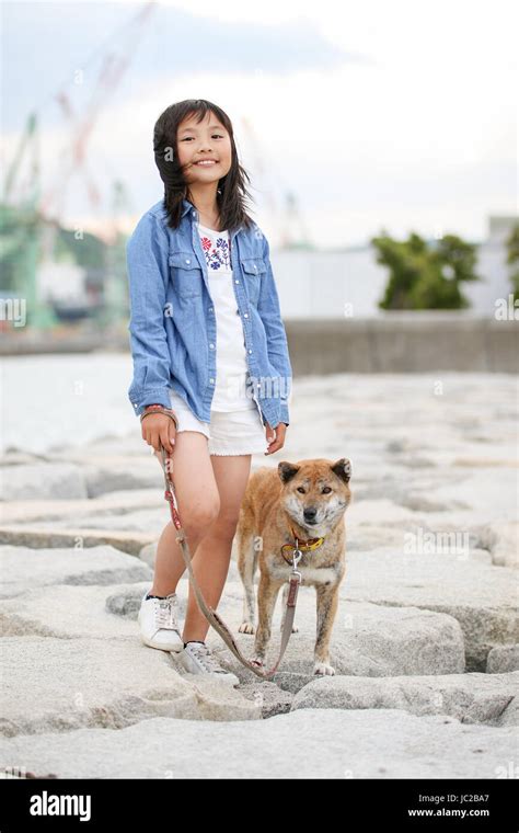 Girl and Shiba Inu Stock Photo - Alamy