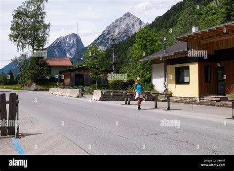 Crossing the border from Austria to Germany next to the disused border ...