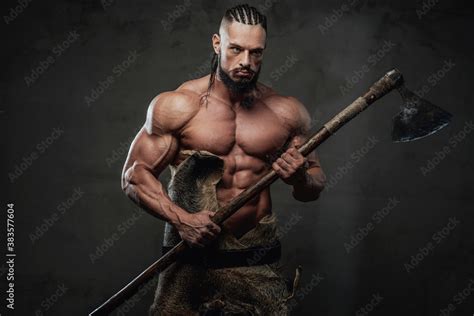 Prepared To Battle Viking With Naked Torso Dreadlock And Black Beard Posing Holding His Axe In