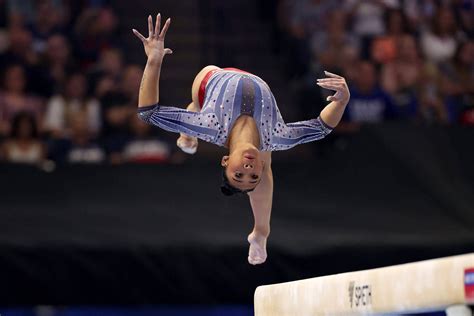 Gold medalist Suni Lee is back at the Olympics. A team doctor helped ...