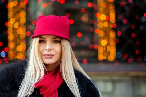 Premium Photo Pretty Blonde Model Wearing Funny Red Cap And Scarf