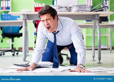 The Frustrated Businessman Stressed From Excessive Work Stock Image