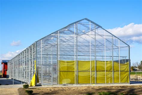 Construction of a New Large Greenhouse with a Metal Frame in a Rural ...