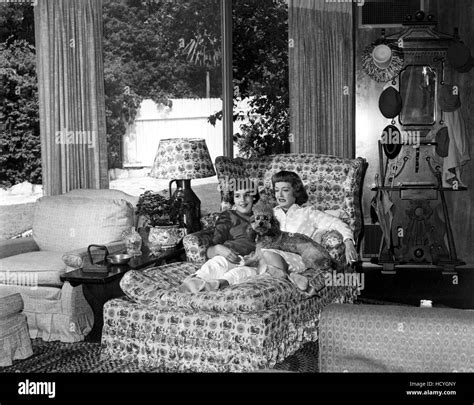 13 year old MARGOT MERRILL relaxes with mother BETTE DAVIS in their Bel ...