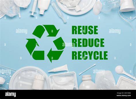 Recycling sybmol with reuse reduce recycle slogan surrounded by single-use plastic objects ...