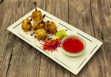 The Chinese fried frog legs with sweet-sour sauce — Stock Photo ...