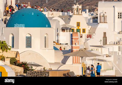 Blue Domed Greek Orthodox Church At Oia Village On Santorini Island