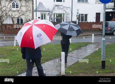 Residents with huge umbrellas Datchet Floods Stock Photo - Alamy