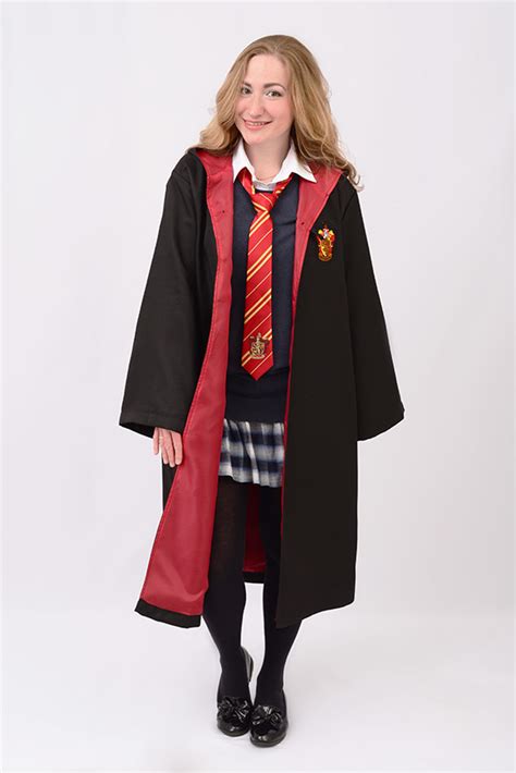a woman in a harry potter costume poses for a photo while wearing a red ...
