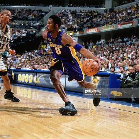 Kobe Bryant Of The Los Angeles Lakers Drives To The Basket Against