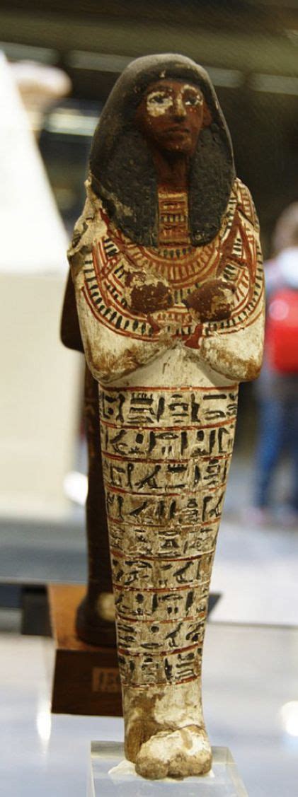 an ancient egyptian statue on display in a museum