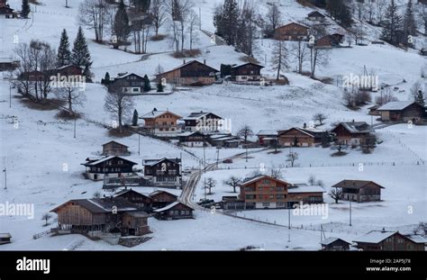 The Alpine village of Grindelwald, Switzerland, photographed at dusk in ...