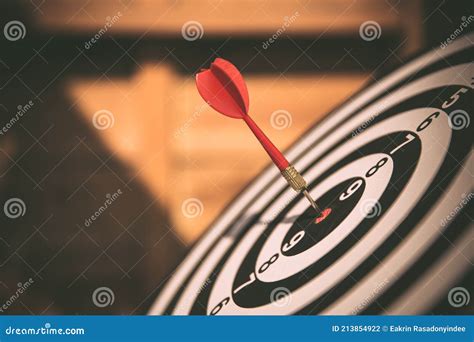 Close Up The Bullseye Or Bulls Eye Target Or Dart Board Has Dart Arrow