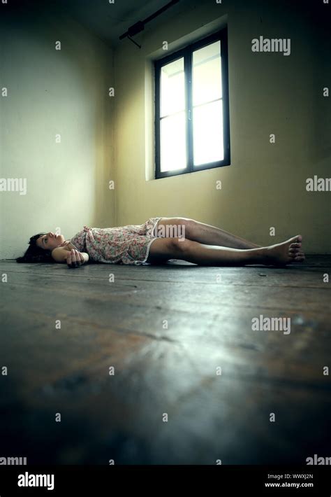 Dead Woman Lying On The Wooden Floor Empty Room Stock Photo Alamy