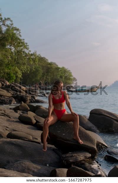 Sexy Tanned Brunette Red Bikini Sitting Stock Photo 1667287975 Shutterstock
