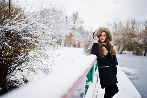 Free Photo Beautiful Brunette Girl In Winter Warm Clothing Model On Winter Jacket Against