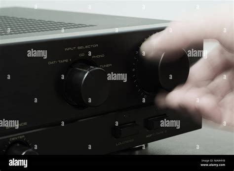 Blurred Hand Adjusting Volume Control Stock Photo Alamy