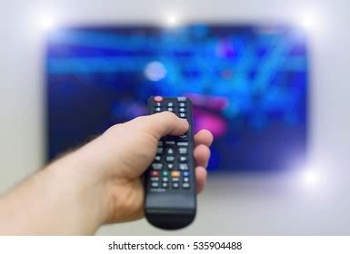 Male Hand Holding Tv Remote Control Stock Photo Shutterstock