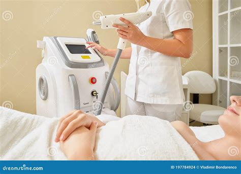 Cosmetology Beautiful Woman Receiving Laser Hair Removal Procedure At