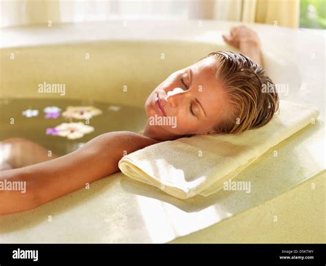 Woman Relaxing In Bathtub Stock Photo Alamy