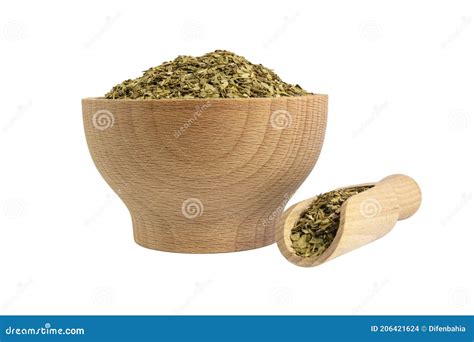 Dried Leaves Of Yerba Mate Tea In Wooden Bowl And Scoop Isolated On