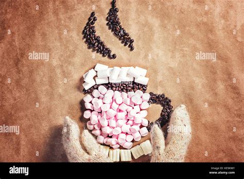Mug Cup Of Hot Coffee Cocoa From Pink Marshmallows And Grain Coffee On Old Paper Background