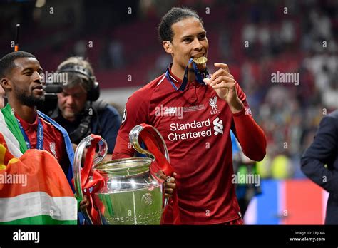 Virgil Van Dijk Holding Champions League Trophy