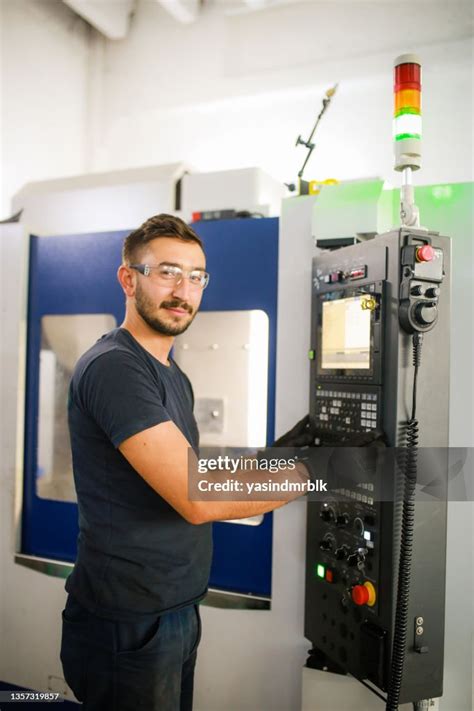 Mechanical Technician Worker At Modern Cnc Metal Machining Milling