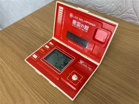 BANDAI AKURYO NO Yakata Solar Power 1982 LCD Electronic Game Make An