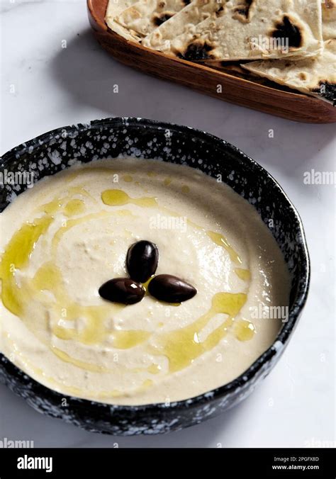 Taramasalata In The Bowl With Olive Oil And Black Olive Taramasalata