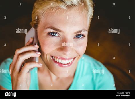 Pretty Blonde Woman Using Her Smartphone Stock Photo Alamy