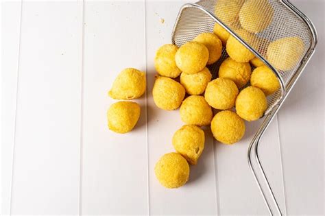 Premium Photo | Traditional fried coxinha over table, also some cheese ...