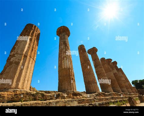 Sunshine above ruined Temple of Heracles columns in famous ancient ...