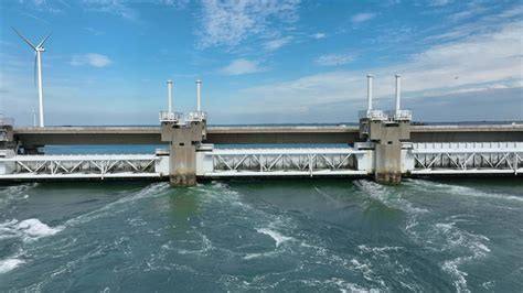 Sea Water Rushing Through a Storm Surge Barrier Protecting the Mainland