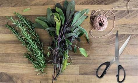 Scissors Sprigs And Twine On A Wooden Table