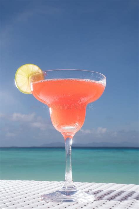 Strawberry Daiquiri Cocktail In Woman`s Hand At The Beach Restaurant