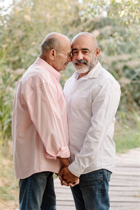 Affectionate Middle Aged Gay Couple Enjoying Lovely Moments Together During A Date In A Park